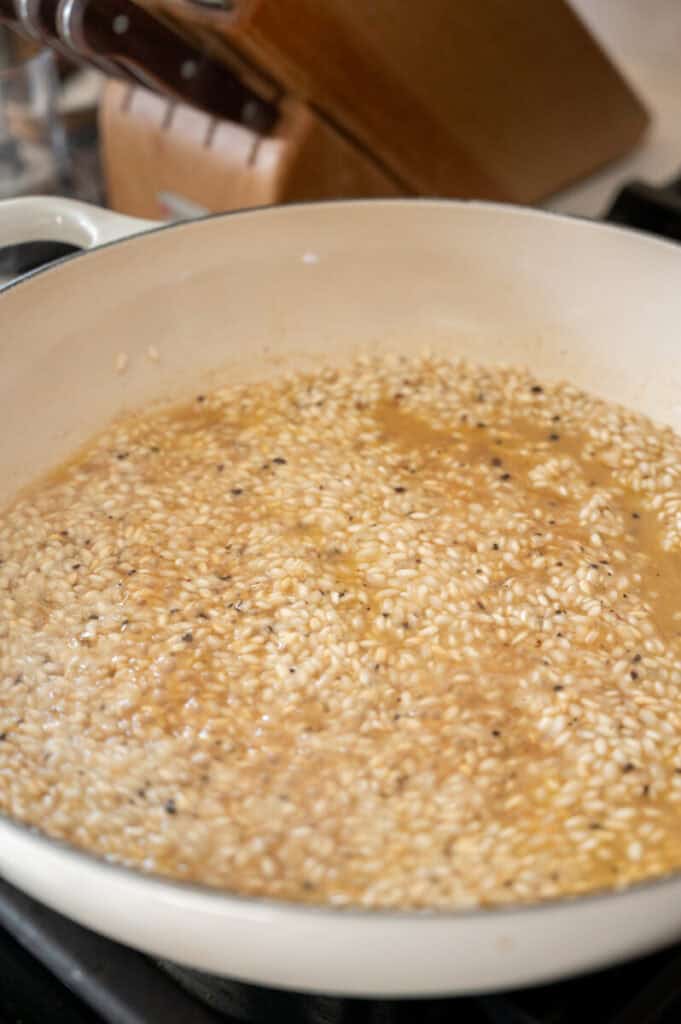 Arborio rice cooking in chicken stock.