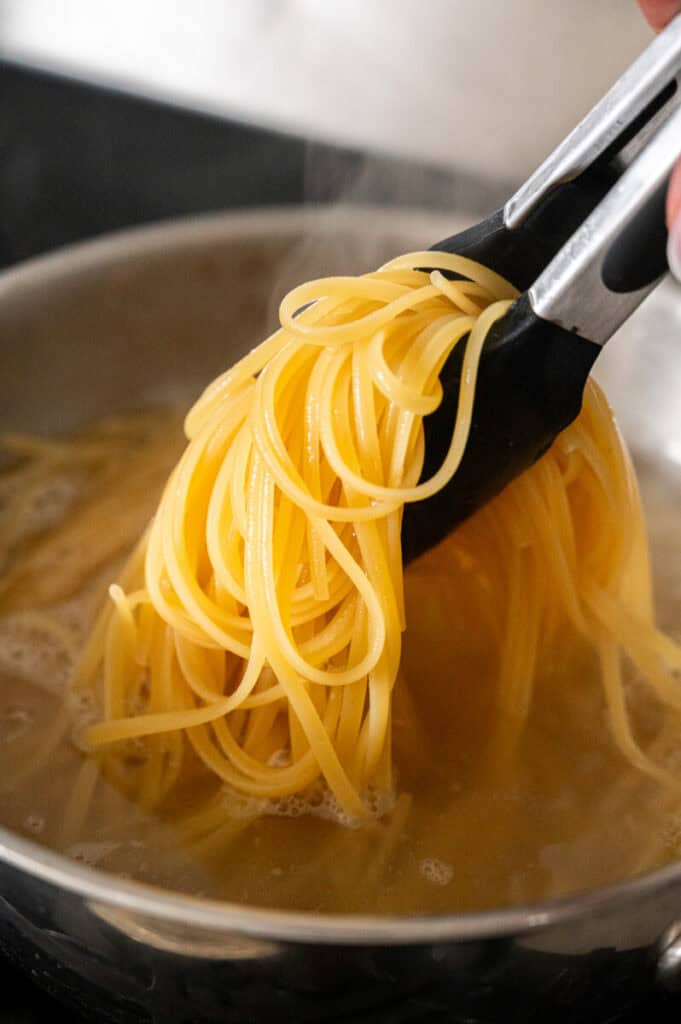 linguine cooking in a pot.