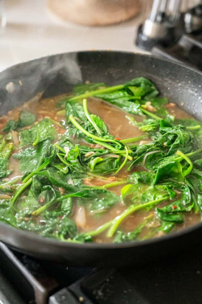 white wine, garlic, lemon, and spinach sauce.