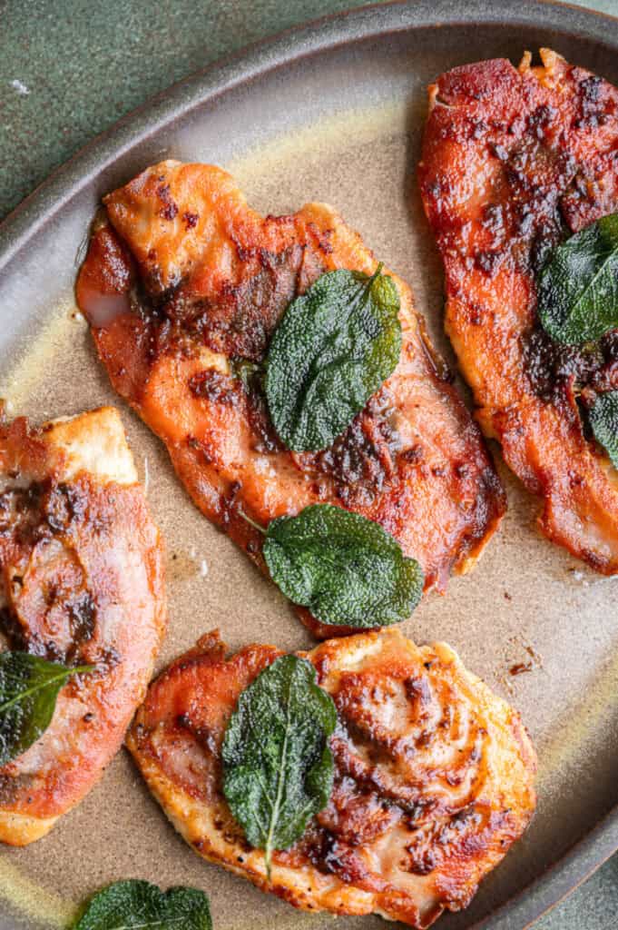 close up shot of chicken saltimbocca on a plate.