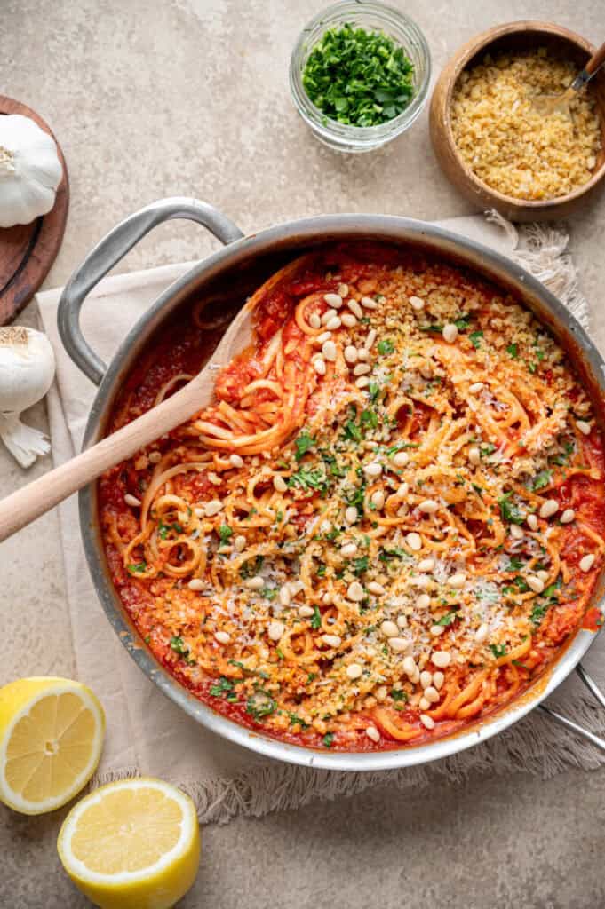 pasta milanese in a pan with a spoon.