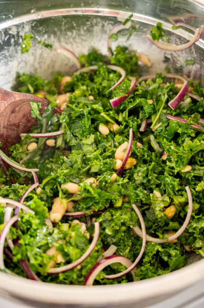 kale and cannellini bean salad in a large bowl.