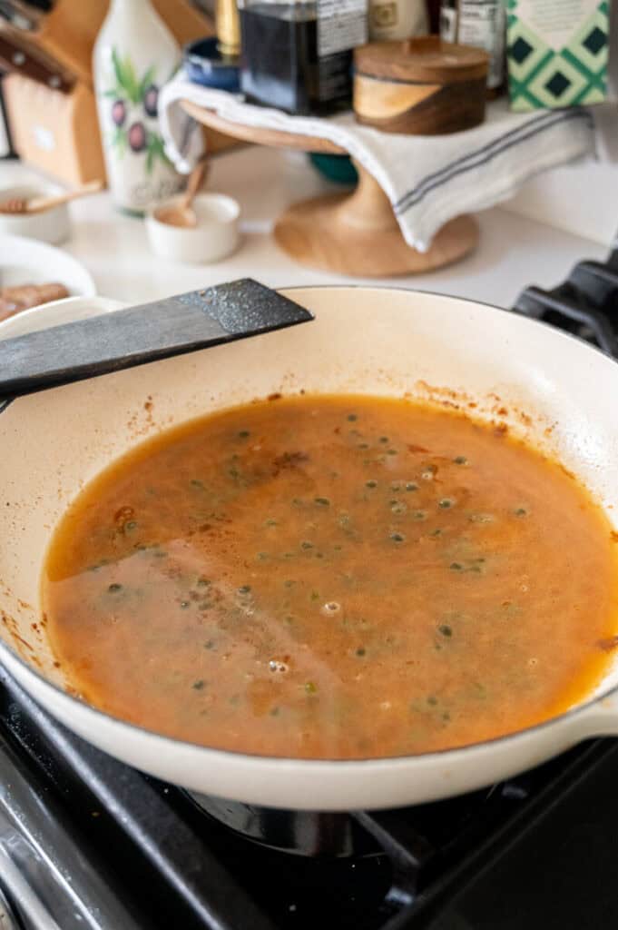 piccata sauce in a skillet.