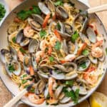 clam and shrimp pasta in a skillet.
