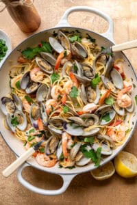 clam and shrimp pasta in a skillet.