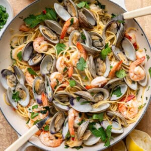 clam and shrimp pasta in a skillet.
