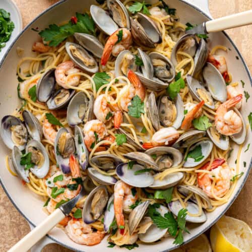 clam and shrimp pasta in a skillet.